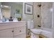 Well-lit bathroom features modern vanity, updated fixtures, and stylish shower providing a clean and relaxing space at 4302 Nepal St, Denver, CO 80249