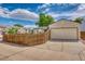 Home featuring a two-car garage and fenced yard, providing both parking and outdoor privacy at 4302 Nepal St, Denver, CO 80249