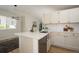 Beautiful kitchen showcasing stone countertops, updated cabinets and stainless appliances at 4302 Nepal St, Denver, CO 80249