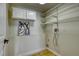 Practical laundry room with storage shelves and convenient hookups for laundry appliances at 4302 Nepal St, Denver, CO 80249