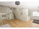 View of staircase and living area featuring fresh paint and hardwood flooring at 4302 Nepal St, Denver, CO 80249