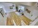Spacious living room with updated floors, neutral paint, and ample natural light creating a warm and inviting atmosphere at 4302 Nepal St, Denver, CO 80249