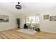 Living room showcasing updated lighting, fresh paint and natural light at 4302 Nepal St, Denver, CO 80249