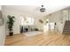 Bright living room featuring new hardwood floors, fresh paint and abundant natural light at 4302 Nepal St, Denver, CO 80249