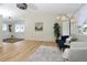Bright living room features recessed lighting, hardwood floors, and fresh paint at 4302 Nepal St, Denver, CO 80249