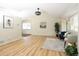 Spacious and bright living room featuring updated hardwood flooring at 4302 Nepal St, Denver, CO 80249