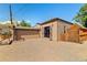 Backyard showcasing a spacious brick patio, a detached garage, and a pergola-covered dining area at 4425 Irving St, Denver, CO 80211