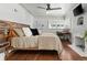 Comfortable bedroom with hardwood floors, a ceiling fan, and a dedicated workspace at 4425 Irving St, Denver, CO 80211