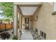 Welcoming entryway with a covered porch, stylish door, and rock landscaping alongside the walkway at 4425 Irving St, Denver, CO 80211