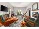 Bright living room with fireplace, modern furniture, and lots of natural light at 4425 Irving St, Denver, CO 80211