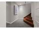 View of the finished basement staircase featuring carpeted steps, and neutral paint at 4425 Irving St, Denver, CO 80211