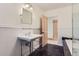 Bathroom with pedestal sink and marble floor at 5635 E 17Th Avenue Pkwy, Denver, CO 80220