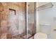 Clean bathroom with shower and tile surround at 5635 E 17Th Avenue Pkwy, Denver, CO 80220