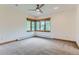 Bright bedroom featuring carpet and a bay window at 5635 E 17Th Avenue Pkwy, Denver, CO 80220