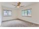 Bright bedroom with neutral carpeting and multiple windows at 5635 E 17Th Avenue Pkwy, Denver, CO 80220