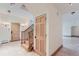 Bright entryway with tile floors, wooden staircase, and built-in storage at 5635 E 17Th Avenue Pkwy, Denver, CO 80220