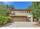 Three-car garage with large driveway at 5635 E 17Th Avenue Pkwy, Denver, CO 80220