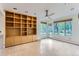 Gathering room with built-in shelving and backyard access at 5635 E 17Th Avenue Pkwy, Denver, CO 80220