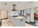 Bright kitchen with an island and view to backyard at 5635 E 17Th Avenue Pkwy, Denver, CO 80220