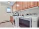 Laundry room with washer, dryer and cabinets at 5635 E 17Th Avenue Pkwy, Denver, CO 80220