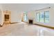 Bright and airy living room with fireplace and large windows at 5635 E 17Th Avenue Pkwy, Denver, CO 80220