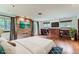 Spacious main bedroom with stone accent wall and built-in shelves at 5635 E 17Th Avenue Pkwy, Denver, CO 80220