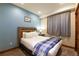 Bedroom with a soft, inviting bed and soothing blue walls; a calm retreat at 302 N Main St, Breckenridge, CO 80424
