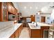 Modern kitchen featuring stainless appliances, granite counters, an island with a wine cooler, and wood floors at 302 N Main St, Breckenridge, CO 80424