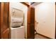 Convenient laundry area with stacked washer and dryer, close to entry and stairs at 302 N Main St, Breckenridge, CO 80424
