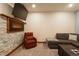 Cozy living room with electric fireplace, TV, plush seating, and neutral carpet at 302 N Main St, Breckenridge, CO 80424