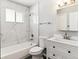 Modern bathroom featuring tiled shower, and vanity with storage at 1927 S Peoria St, Aurora, CO 80014