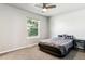 Neutral bedroom with a ceiling fan and window allowing natural light at 1927 S Peoria St, Aurora, CO 80014