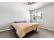 Cozy bedroom featuring a ceiling fan, natural light, and neutral decor at 1927 S Peoria St, Aurora, CO 80014