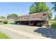 A sunny shot of the townhomes showing the driveways and solar panels at 1927 S Peoria St, Aurora, CO 80014