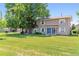Charming townhome with a well-manicured lawn and a large shade tree in a quiet neighborhood at 1927 S Peoria St, Aurora, CO 80014