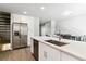 Beautiful kitchen with stainless steel appliances, a large island, and an adjacent dining area at 1927 S Peoria St, Aurora, CO 80014
