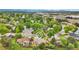 A beautiful aerial view of the home, highlighting its location within a lush, tree-filled neighborhood at 13624 Omega Cir, Lone Tree, CO 80124