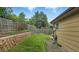 A well-maintained backyard features a retaining wall and a grassy area perfect for outdoor activities at 13624 Omega Cir, Lone Tree, CO 80124