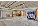 Unfinished basement with open ceiling, a washing machine and dryer, and exercise equipment at 13624 Omega Cir, Lone Tree, CO 80124