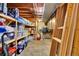 Unfinished basement space with exposed beams, providing ample storage and utility options at 13624 Omega Cir, Lone Tree, CO 80124