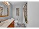 Well-maintained bathroom featuring a vanity, toilet, and a shower-tub combo with stylish curtain at 13624 Omega Cir, Lone Tree, CO 80124