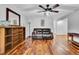Cozy living room with hardwood floors and a dark leather sofa at 13624 Omega Cir, Lone Tree, CO 80124