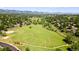 Panoramic aerial showcasing neighborhood with walking trails and mountain views at 7118 W Elmhurst Ave, Littleton, CO 80128