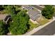 Aerial view showcasing the home's backyard, landscaping, and neighborhood at 7118 W Elmhurst Ave, Littleton, CO 80128