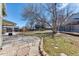 Beautifully landscaped backyard featuring a stone patio at 7118 W Elmhurst Ave, Littleton, CO 80128