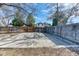 Fenced backyard with a concrete pad, offering ample space at 7118 W Elmhurst Ave, Littleton, CO 80128