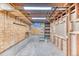 Unfinished basement presents a blank canvas with exposed framing, ideal for customization to create your dream living space at 7118 W Elmhurst Ave, Littleton, CO 80128