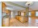 Modern kitchen featuring granite countertops, wood cabinetry, and hardwood flooring at 7118 W Elmhurst Ave, Littleton, CO 80128