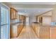 Modern kitchen featuring granite countertops, wood cabinetry, and hardwood flooring at 7118 W Elmhurst Ave, Littleton, CO 80128