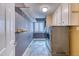 Laundry room featuring a washer, dryer, and ample storage at 7118 W Elmhurst Ave, Littleton, CO 80128